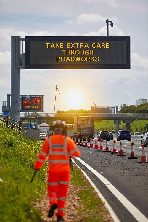 Engineer on motorway SWARCO energy efficient VMS