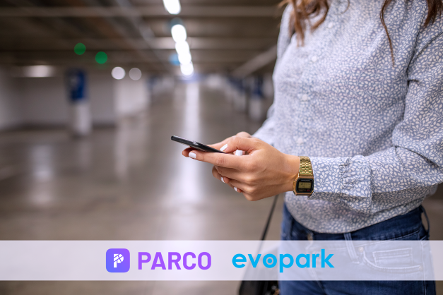 A woman using the PARCO app on her phone in a parking garage. PARCO and evopark logo.